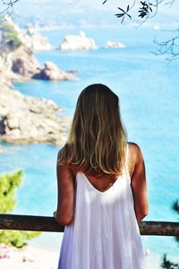 Rear view of woman looking at sea