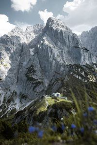 Aerial view of snow covered mountain against sky