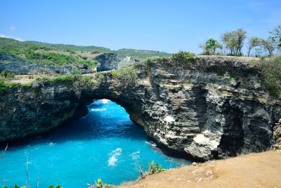 Scenic view of sea against clear blue sky