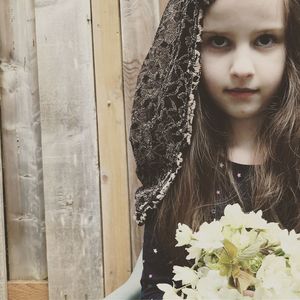 Close-up of beautiful woman with flowers