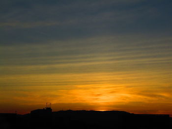 Scenic view of dramatic sky during sunset