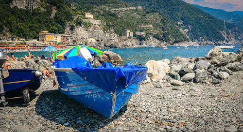 Deck chairs on rocks at shore