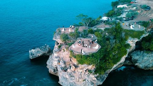 High angle view of rocks by sea