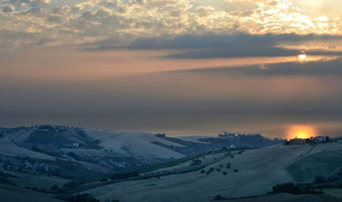 The sun rises on the italian adriatic coast, on a summer day