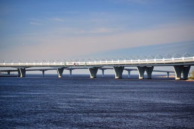 Bridge over sea against sky