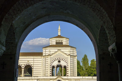 Rear view of church and building against sky