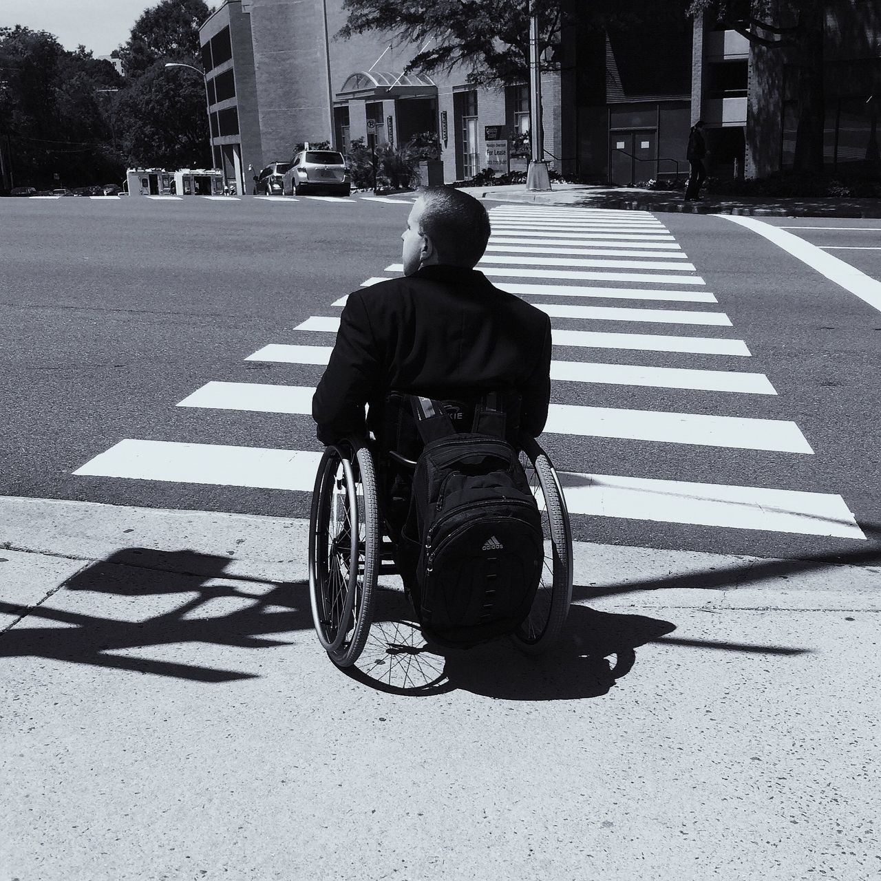 street, building exterior, city, full length, architecture, road, built structure, rear view, lifestyles, walking, city life, road marking, men, transportation, sidewalk, the way forward, sunlight, day