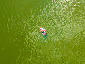 High angle view of person floating on lake