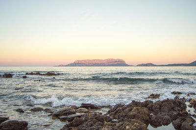 Scenic view of sea against clear sky during sunset