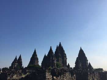 Panoramic view of temple against clear blue sky