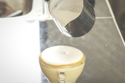 High angle view of coffee cup on table