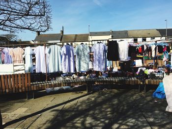 Clothes drying on market stall