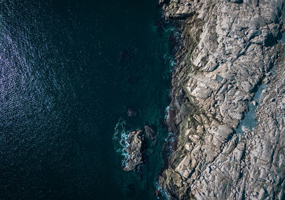 High angle view of rock formation in sea