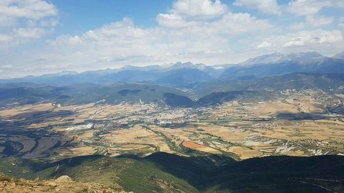 Aerial view of agricultural field against sky