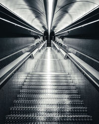 Low angle view of empty escalator in subway station