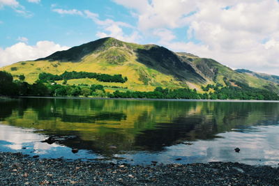 Scenic view of calm lake against sky