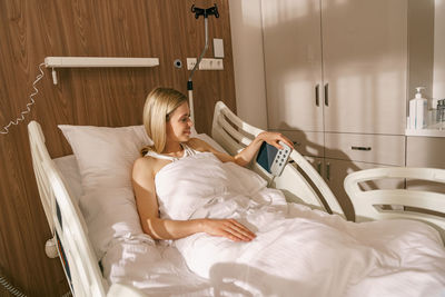 Young woman sleeping on bed at home