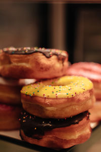 Colorful sweet freshly baked donuts with creamy topping