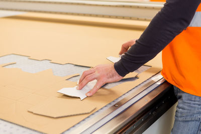 High angle view of man working on paper