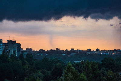 View of townscape against sky at sunset