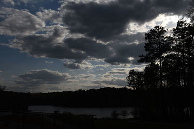 Scenic view of silhouette trees against sky during sunset