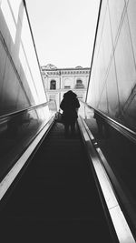 Rear view of woman on railway bridge