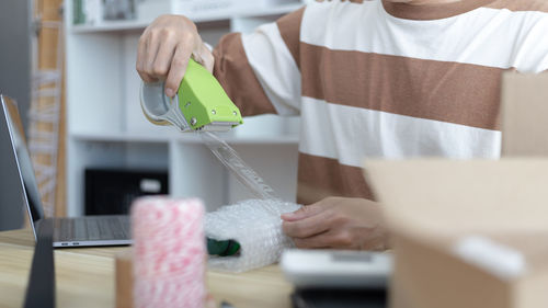 Midsection of woman holding gift box