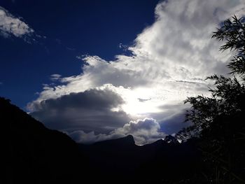 Low angle view of silhouette mountain against sky