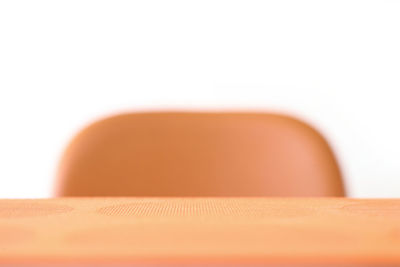 Close-up of cake on table against white background