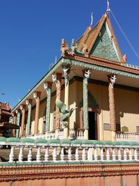 Low angle view of building against blue sky