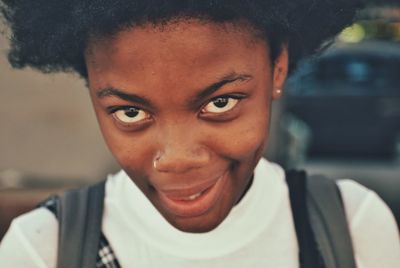 Close-up portrait of a smiling young woman