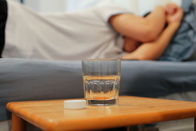 Midsection of man sitting on table