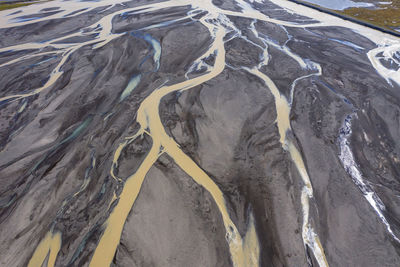 High angle view of tire tracks on beach