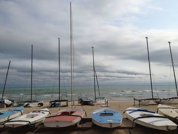 Boats in sea against sky