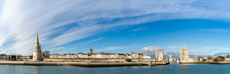 Panoramic view of the old harbor of la rochelle on a sunny day with its famous old towers