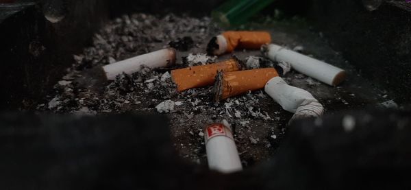 High angle view of cigarette smoking on floor