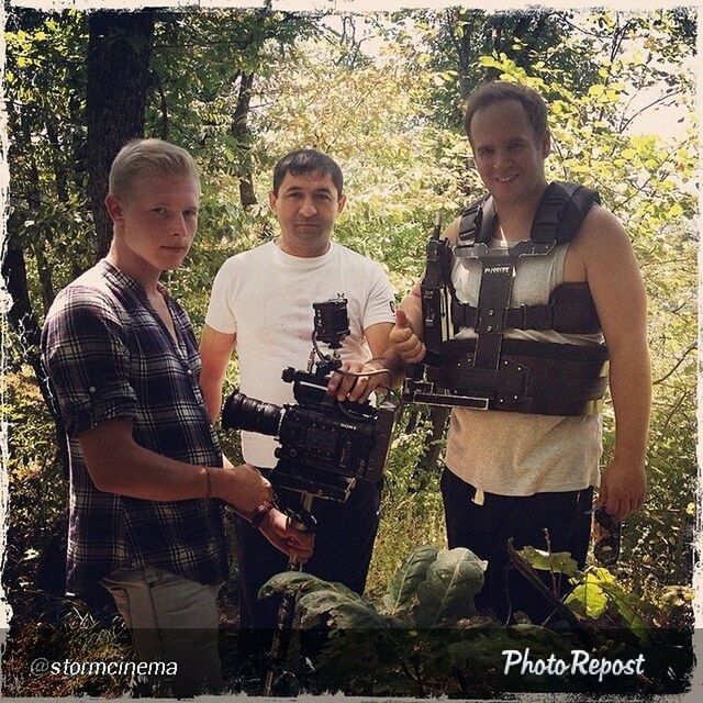 lifestyles, leisure activity, casual clothing, togetherness, young men, person, men, young adult, sitting, bonding, friendship, front view, holding, love, standing, tree, portrait