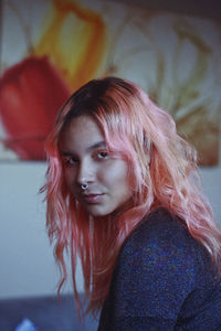 Close-up portrait of young woman with dyed hair