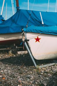 Close-up of boat moored on shore