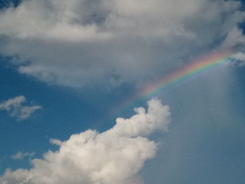 Low angle view of rainbow against sky