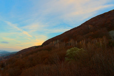 Low angle view of mountain against sky during sunset