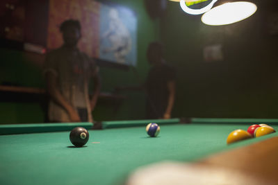 Pool balls on a pool table.