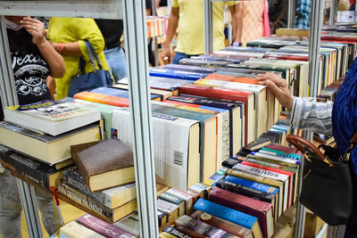 New delhi, india, september 09 2023 - variety of books on shelf inside a book-stall at delhi, india