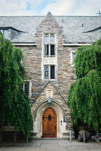 Exterior of building by trees against sky