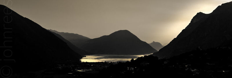 Scenic view of mountains against sky at sunset