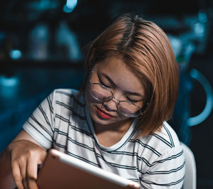 Portrait of girl using mobile phone