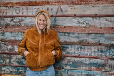 Portrait of smiling young woman standing outdoors