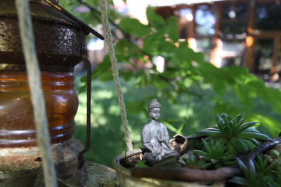 Close-up of statue against plants