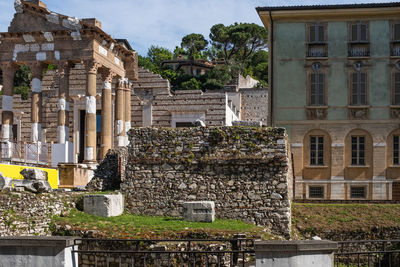 View of the capitolium, 73 a.d., and palazzo maggi gambara, 16th century, in brescia, italy. 