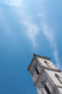 Low angle view of building against sky. low angle view of bell tower against sky. 